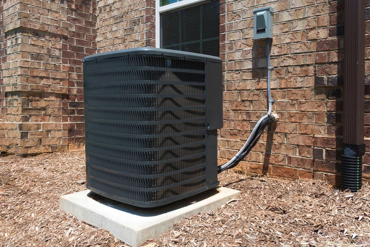 New Black AC Unit Installed For Central Air Conditioning